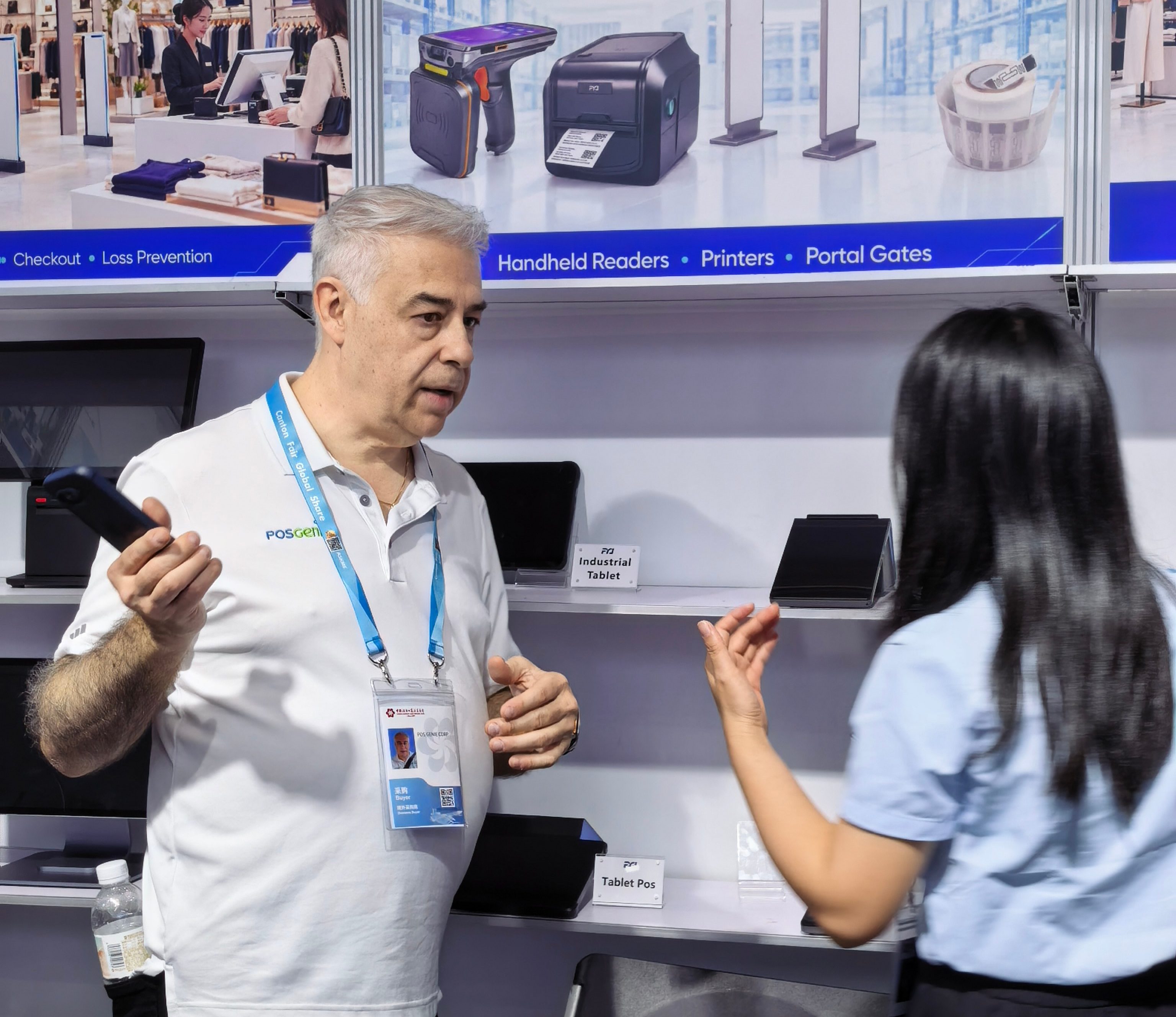 Smart Retail RFID Demonstration Customer exploring RFID checkout, inventory and retail management equipment at the FYJ booth